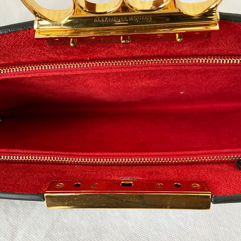 Alexander Mcqueen Skull Four-Ring Clutch Bag