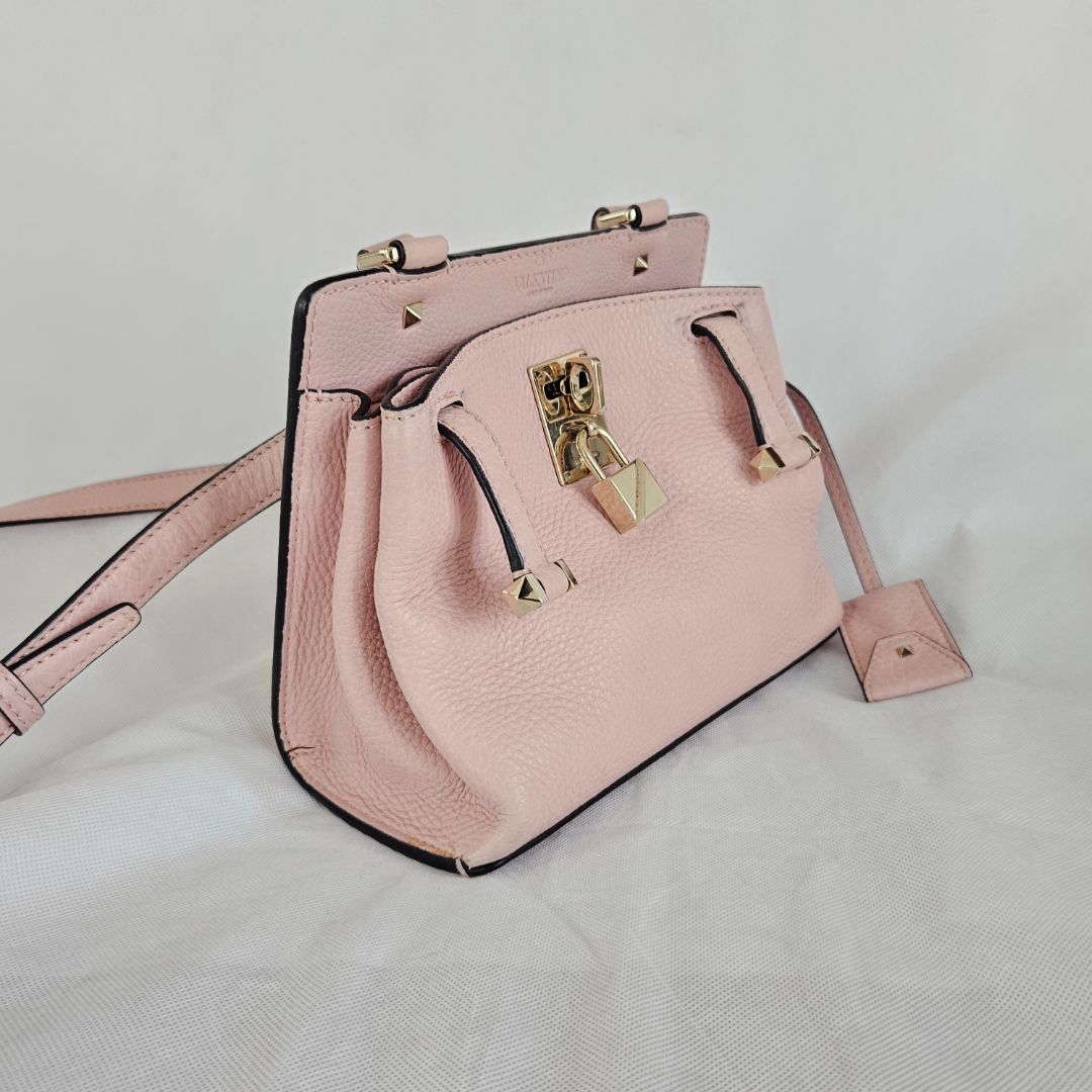 Valentino pink textured leather crossbody flap bag with lock