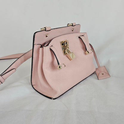 Valentino pink textured leather crossbody flap bag with lock