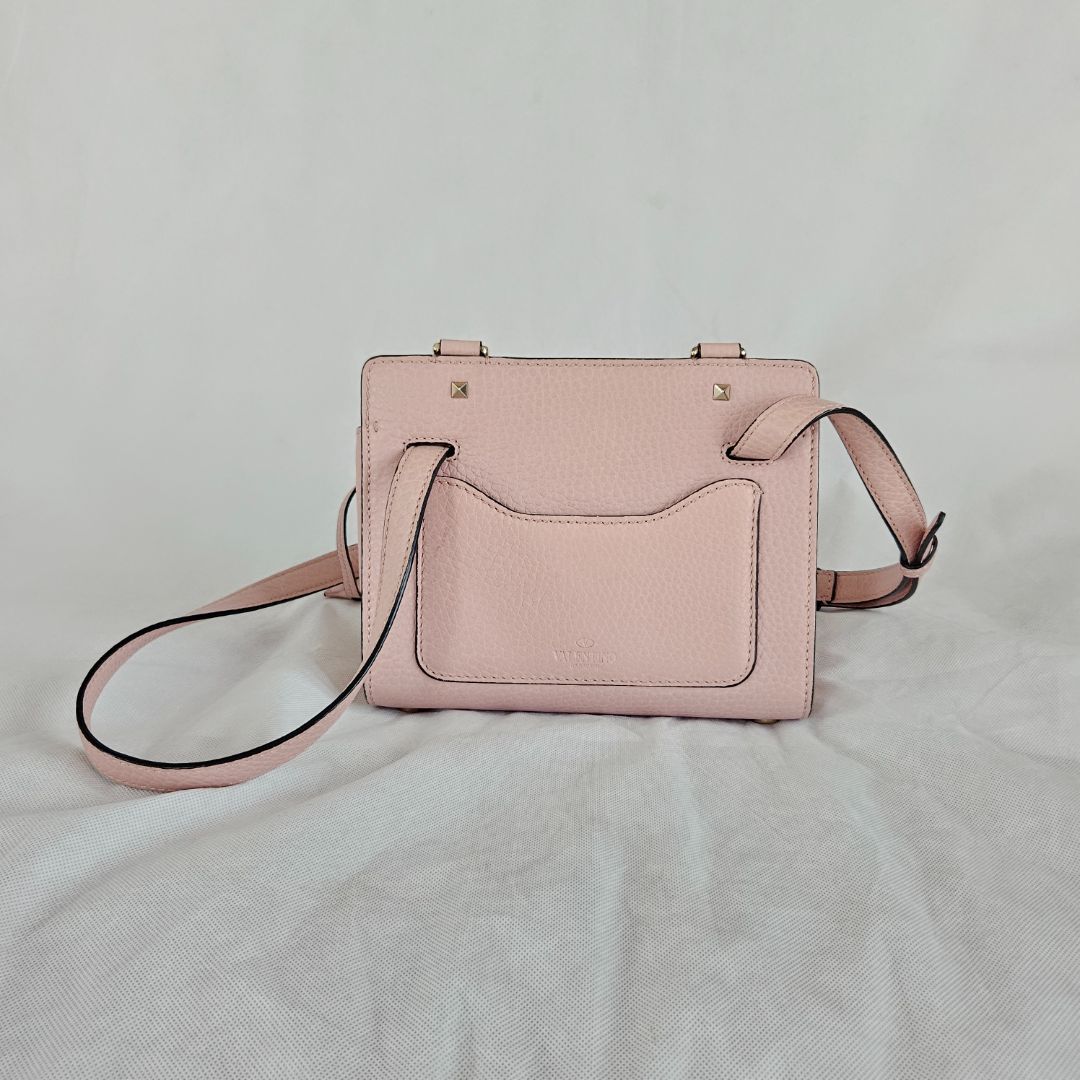 Valentino pink textured leather crossbody flap bag with lock