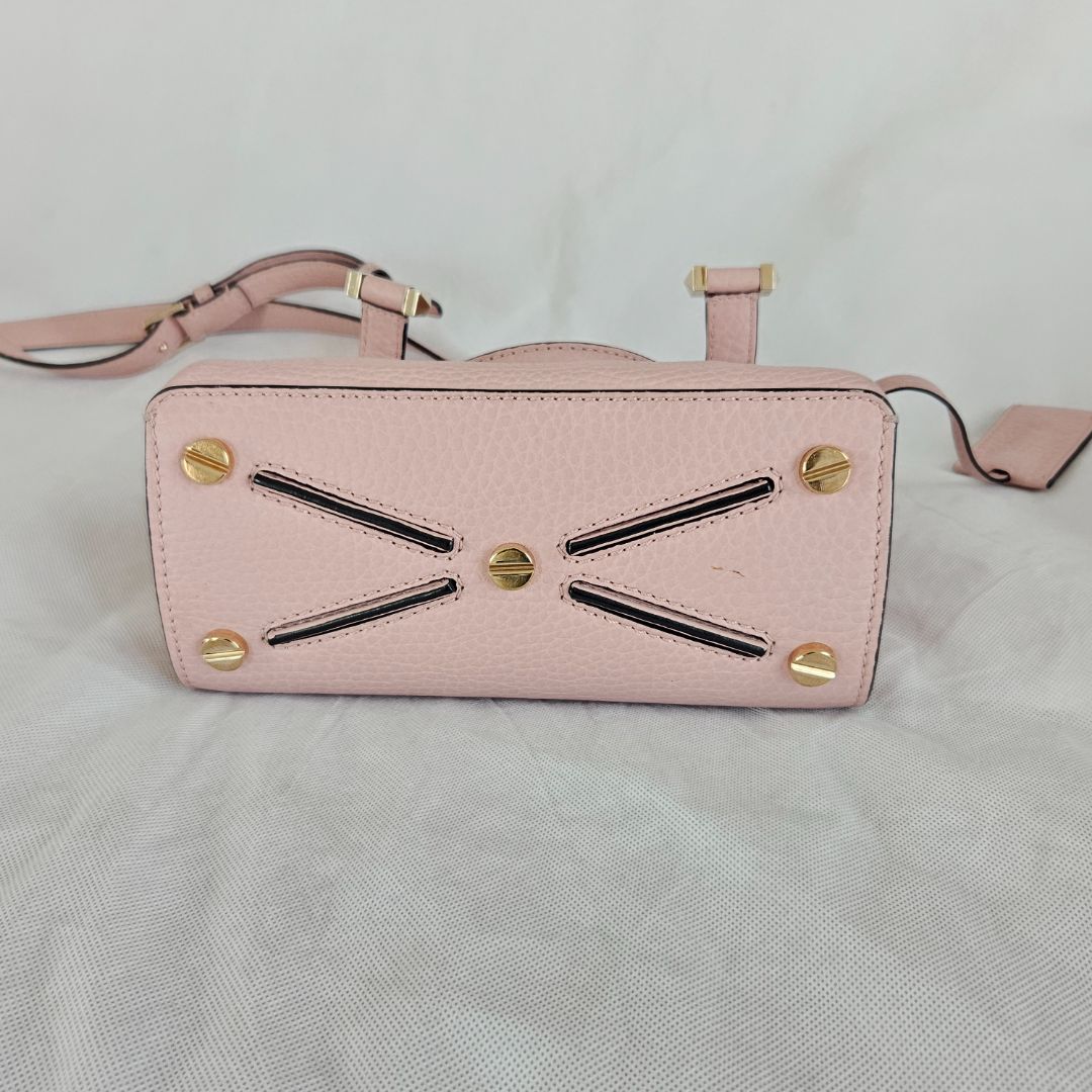 Valentino pink textured leather crossbody flap bag with lock
