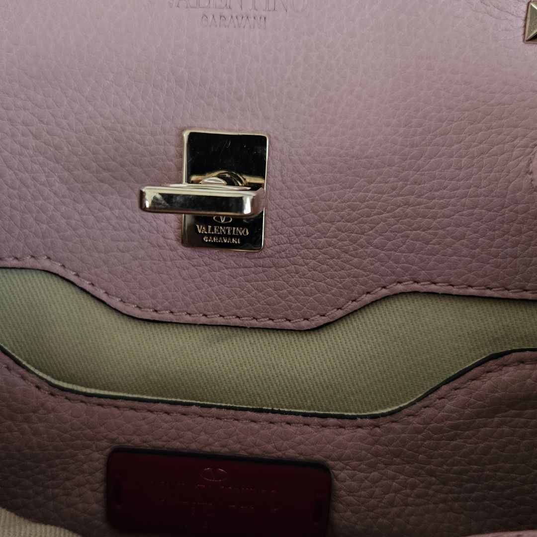 Valentino pink textured leather crossbody flap bag with lock