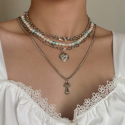 Metal necklace multiple sets of pearls