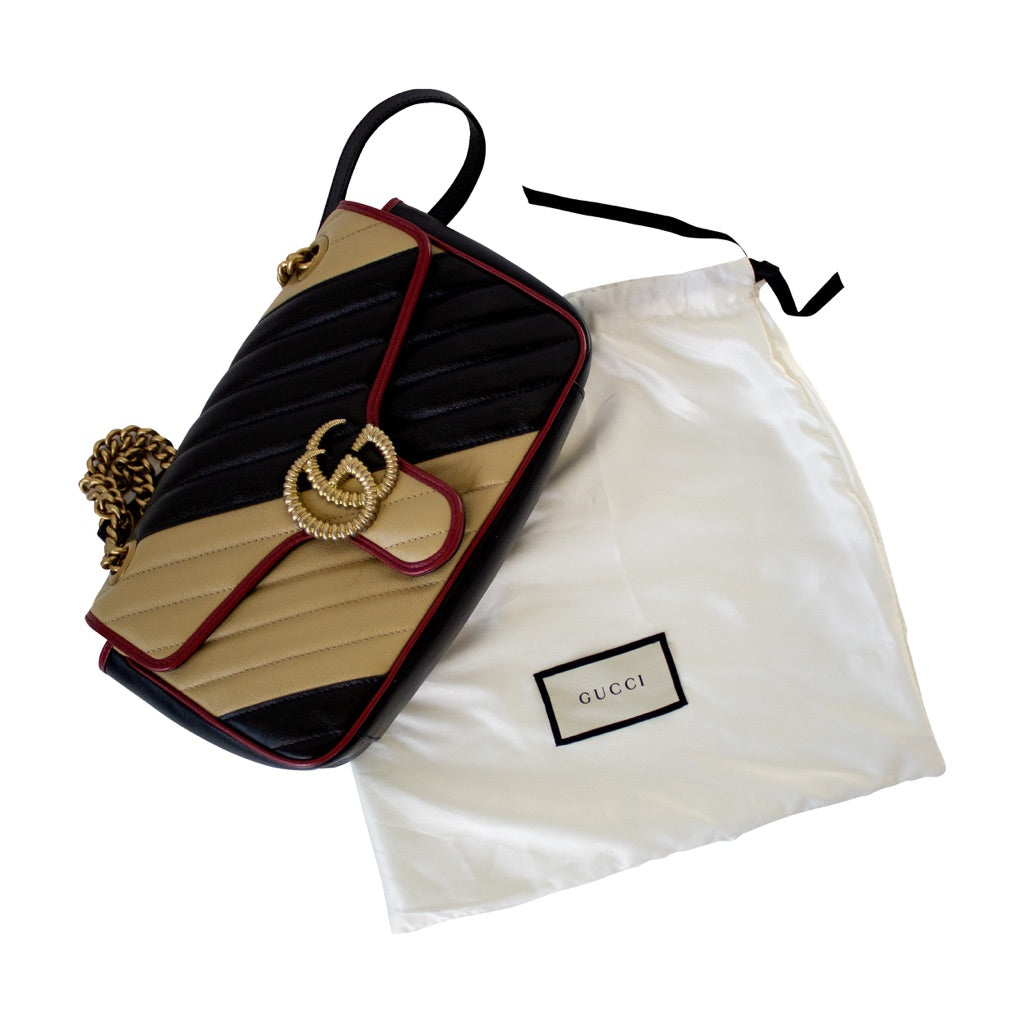 Gucci GG Marmont Small shoulder bag in black and beige quilted leather and red piping
