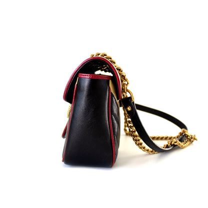Gucci GG Marmont Small shoulder bag in black and beige quilted leather and red piping