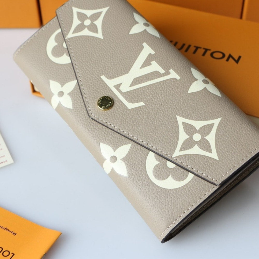 LOUIS VUITTON SARAH WALLET BICOLOR MONOGRAM EMPREINTE TOURTERELLE AND CRÈME 19CM M81049