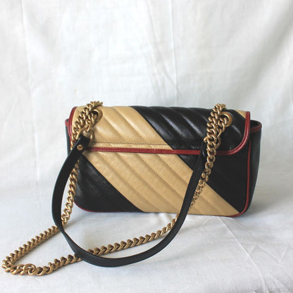 Gucci GG Marmont Small shoulder bag in black and beige quilted leather and red piping