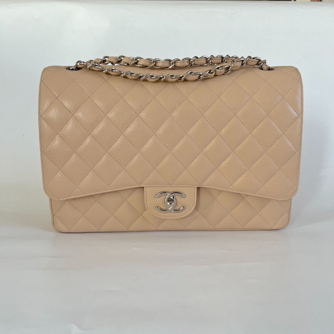 Chanel beige caviar quilted leather maxi double flap bag