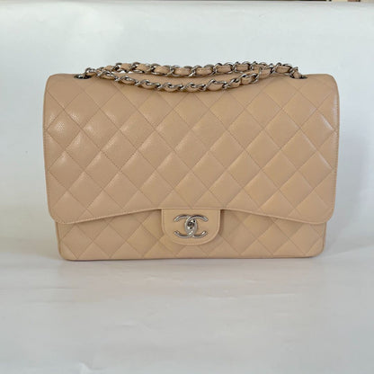 Chanel beige caviar quilted leather maxi double flap bag
