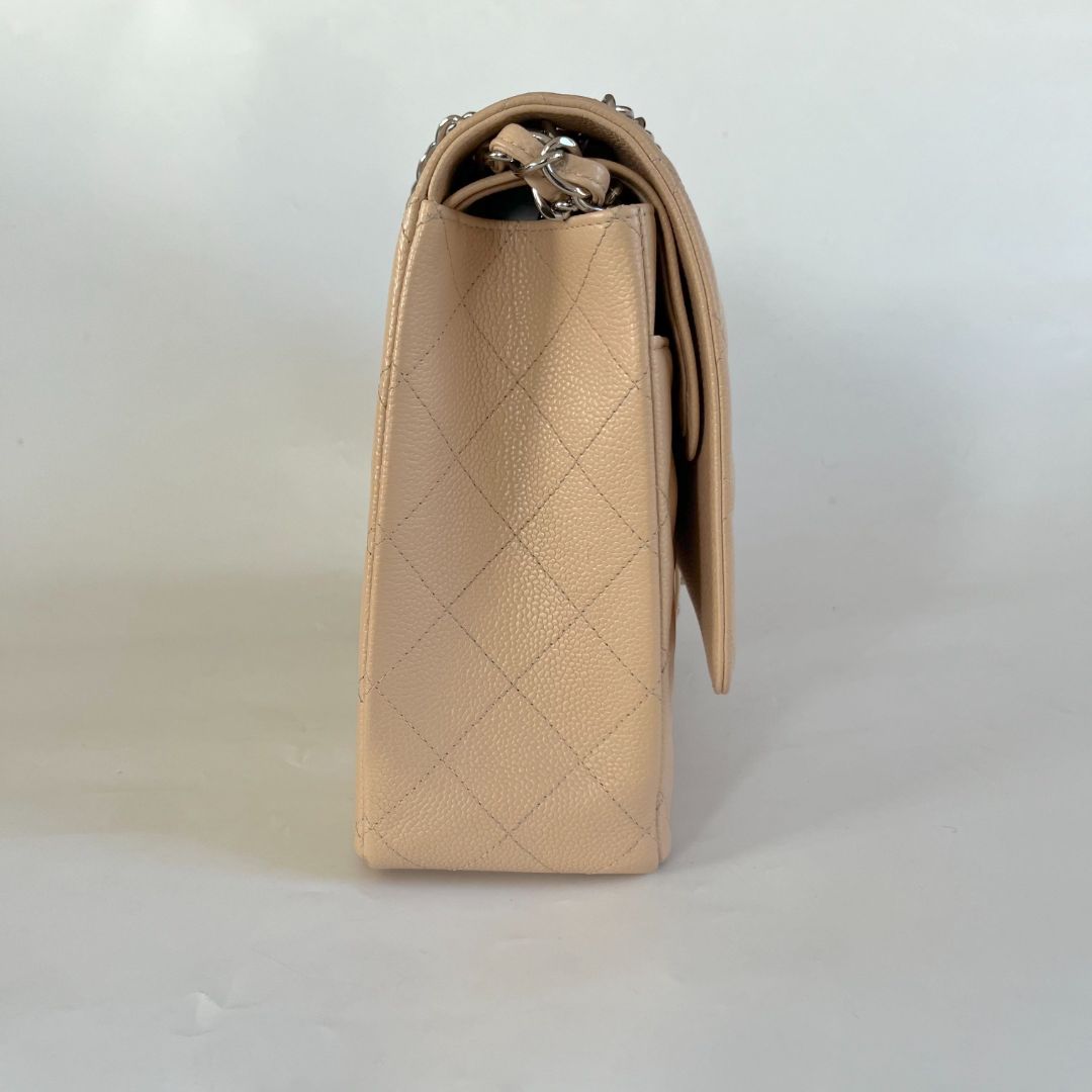 Chanel beige caviar quilted leather maxi double flap bag