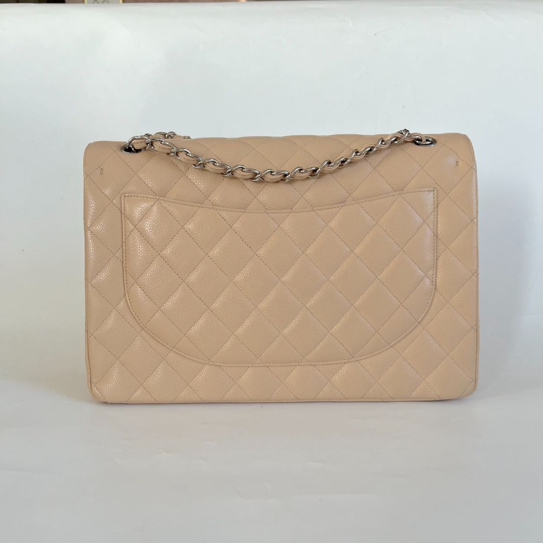 Chanel beige caviar quilted leather maxi double flap bag