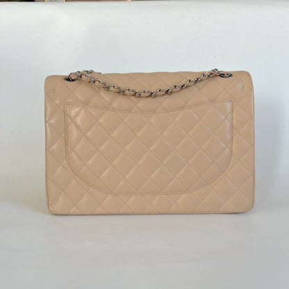 Chanel beige caviar quilted leather maxi double flap bag