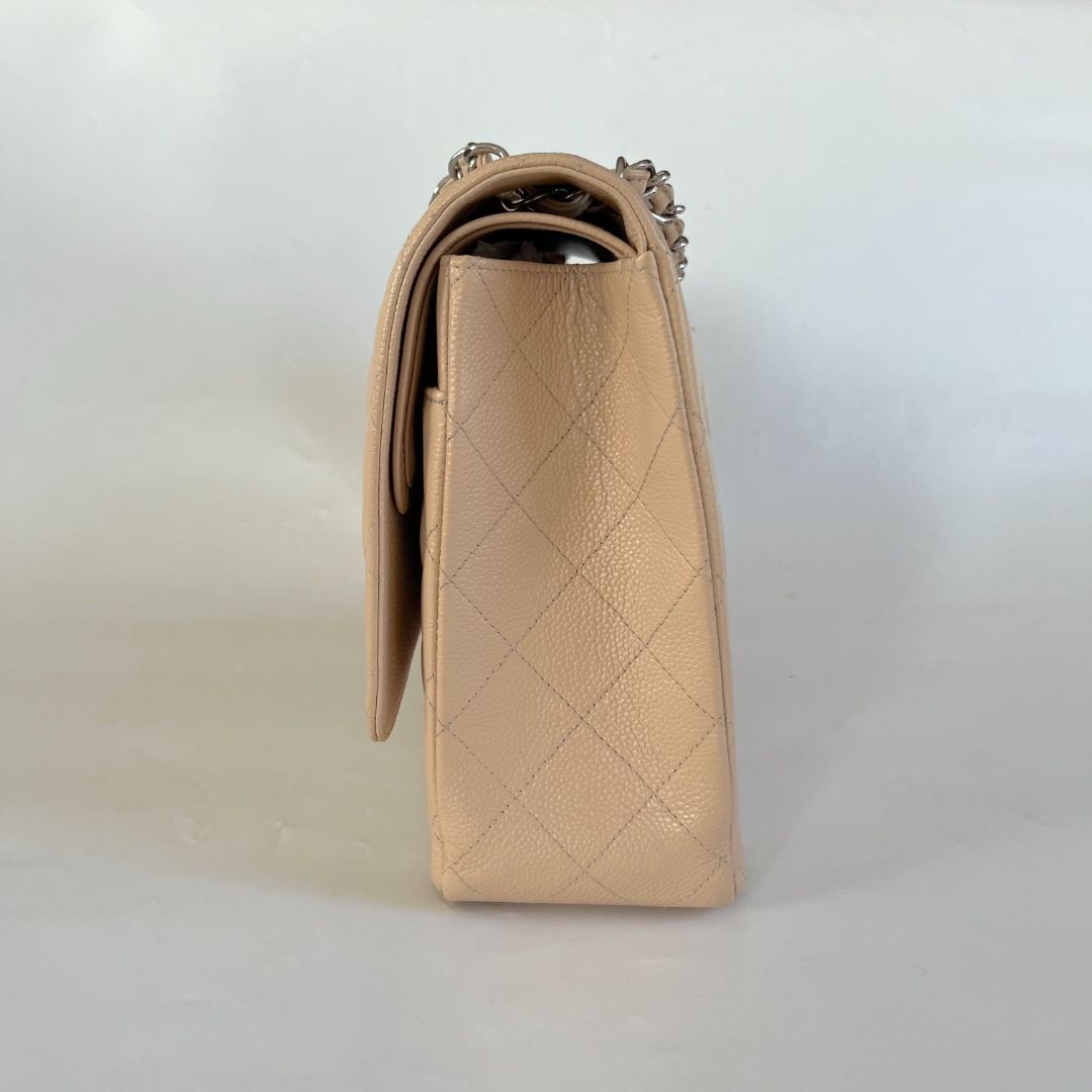 Chanel beige caviar quilted leather maxi double flap bag