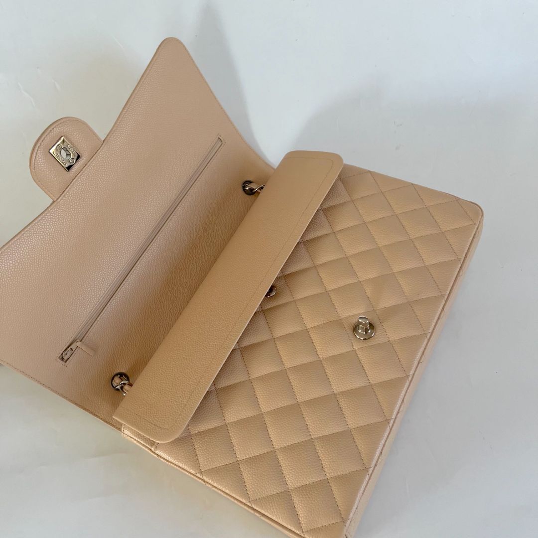 Chanel beige caviar quilted leather maxi double flap bag