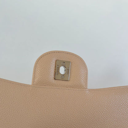 Chanel beige caviar quilted leather maxi double flap bag