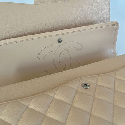 Chanel beige caviar quilted leather maxi double flap bag