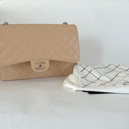 Chanel beige caviar quilted leather maxi double flap bag