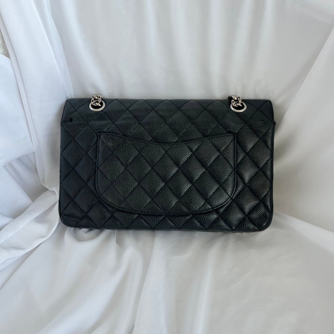 Chanel caviar black flap bag with silver hardware
