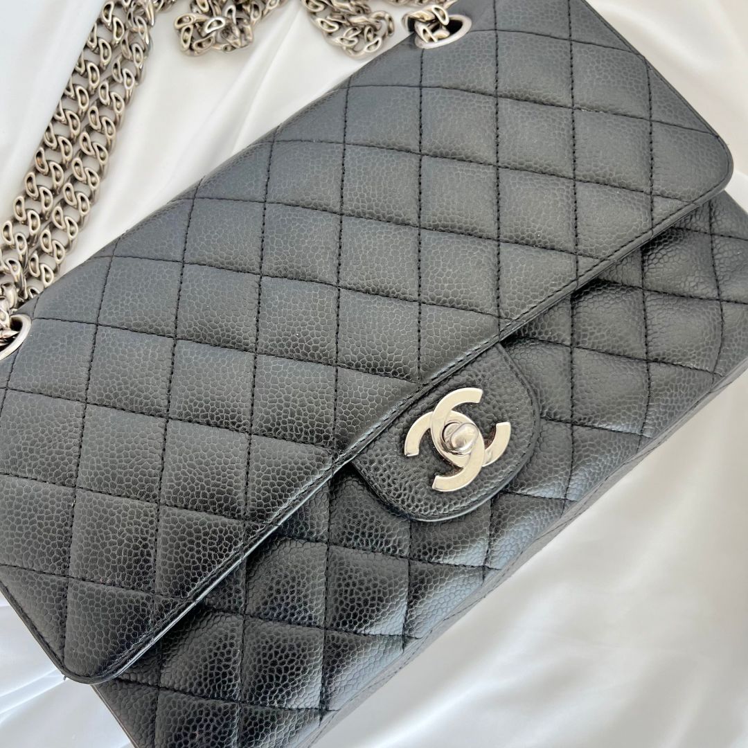 Chanel caviar black flap bag with silver hardware