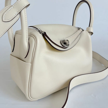 Hermès Mini Lindy Swift leather nata with lime yellow lining bag