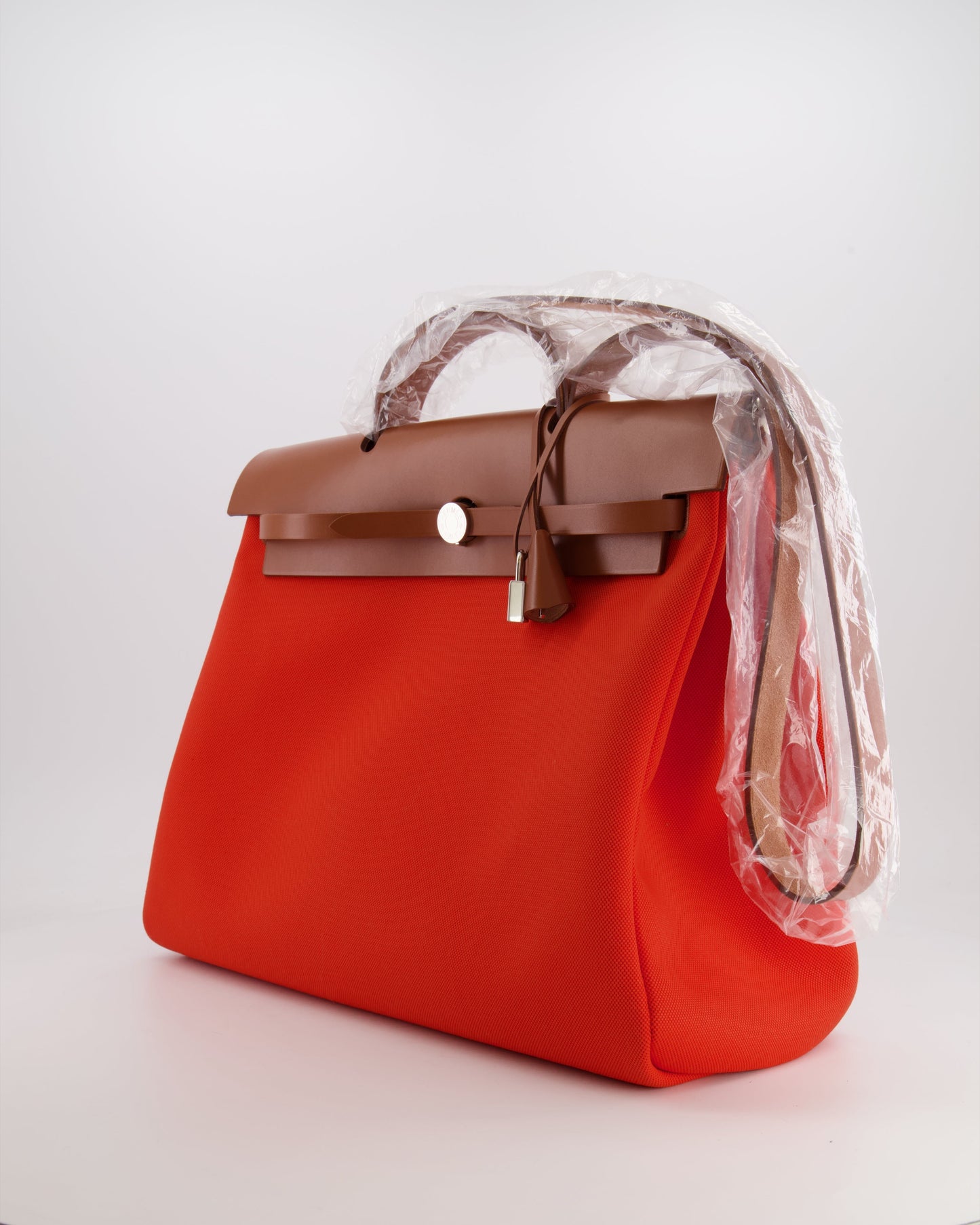 Hermès Herbag 39 in Orange Mecano Toile Canvas and Fauve Vache Hunter Leather with Palladium Hardware