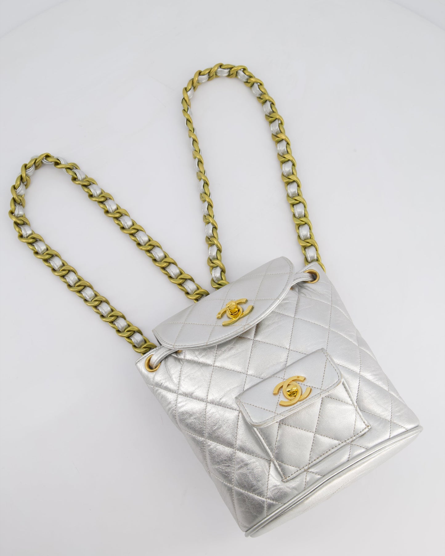 *RARE* Chanel Metallic Silver Vintage Mini Duma Backpack Bag in Lambskin Leather with 24K Gold Hardware
