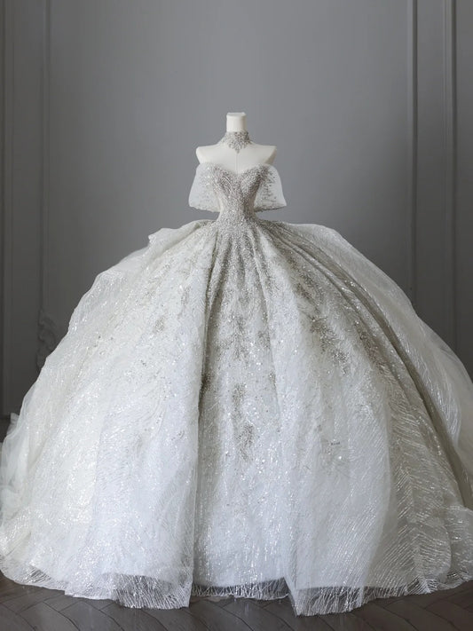 White off-the-shoulder wedding dress with sparkling diamonds and luxurious floor-length design P2509
