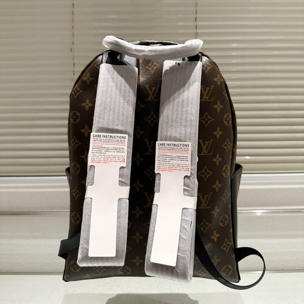 LOUIS VUITTON DISCOVERY PM BACKPACK MACASSAR MONOGRAM BROWN 40CM M46684