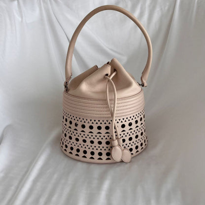 Alaia Laser-cut Corset Bucket Top-handle Bag In Galet