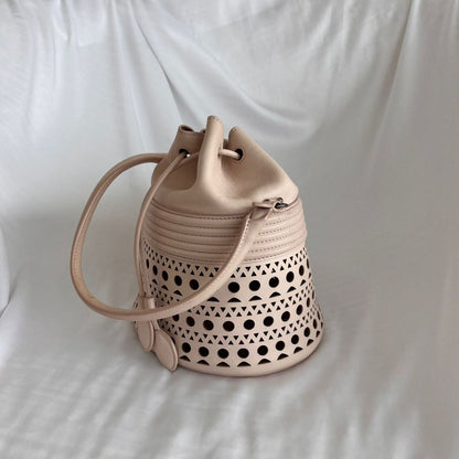 Alaia Laser-cut Corset Bucket Top-handle Bag In Galet