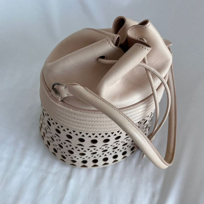Alaia Laser-cut Corset Bucket Top-handle Bag In Galet