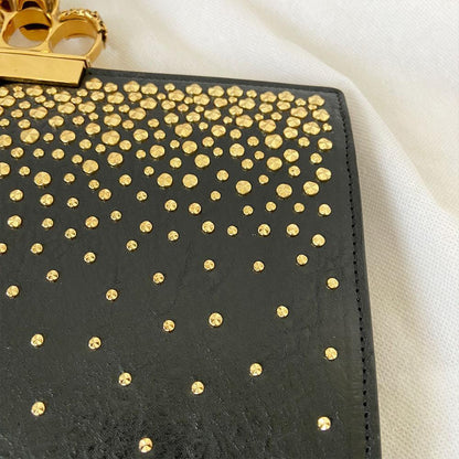 Alexander Mcqueen Skull Four-Ring Clutch Bag