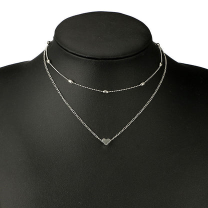 Lovingly simple two-tier brass collar necklace