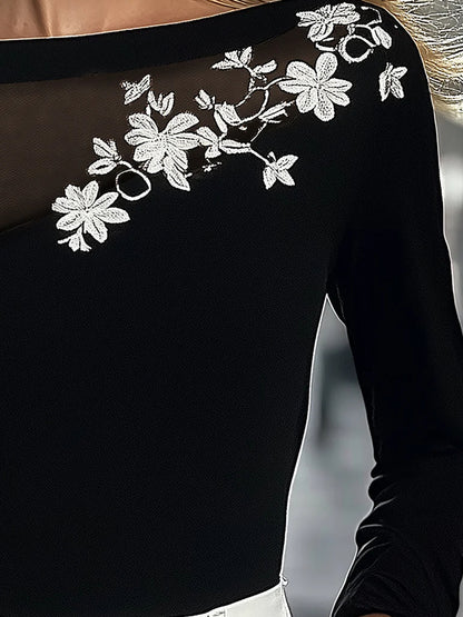 Black Top With Mesh Neckline And Floral Embroidery