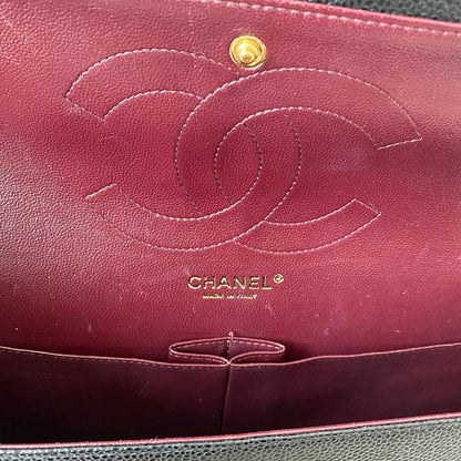 Chanel black jumbo caviar classic flap bag