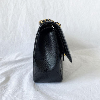 Chanel black jumbo caviar classic flap bag