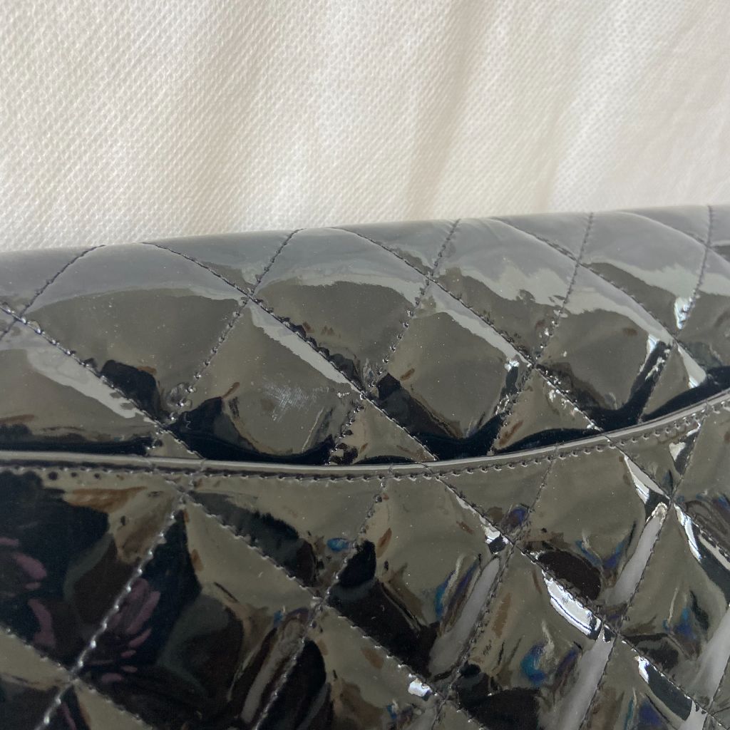 Chanel black quilted patent leather flap bag