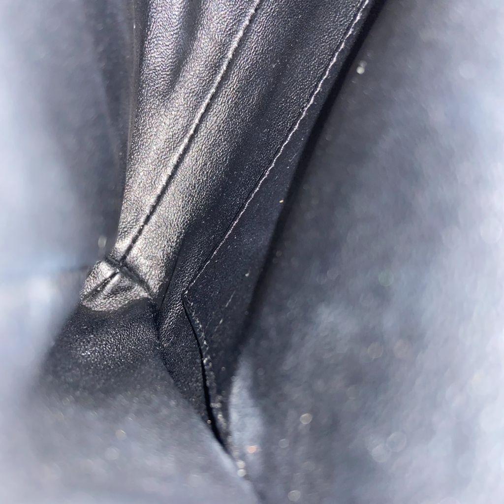 Chanel black quilted patent leather flap bag