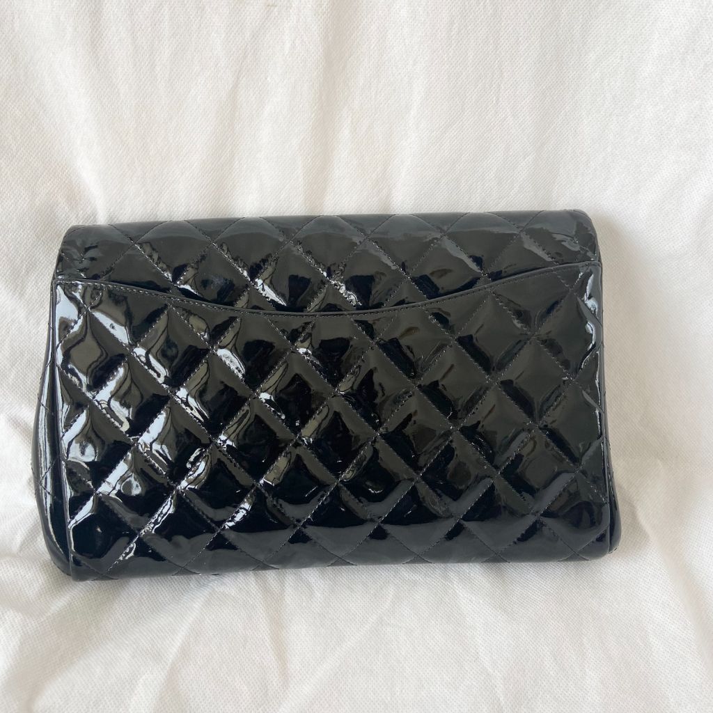 Chanel black quilted patent leather flap bag