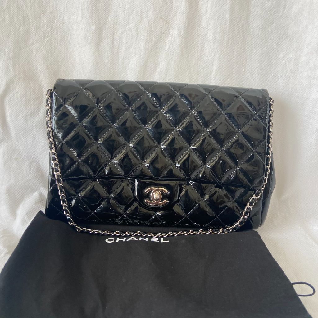 Chanel black quilted patent leather flap bag