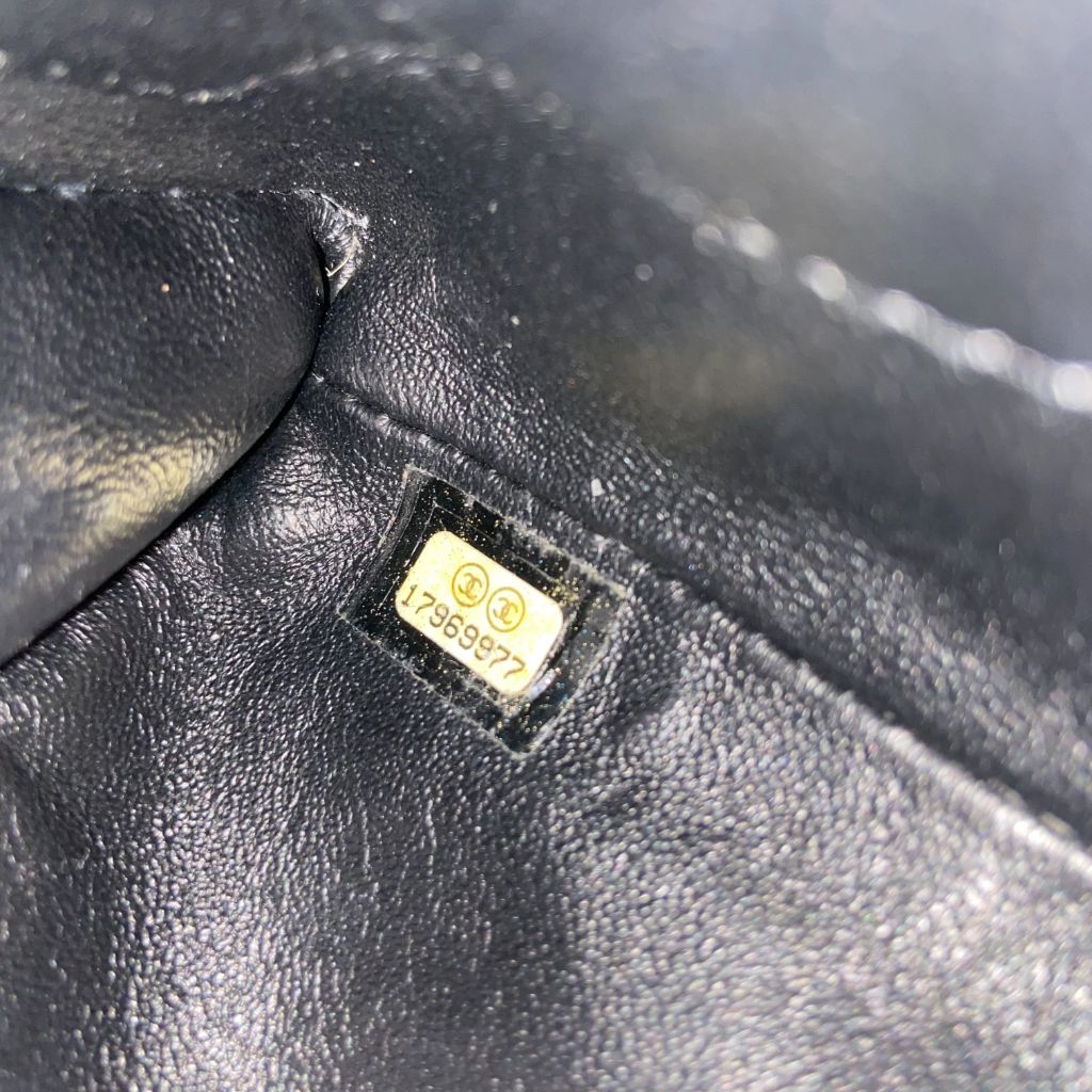 Chanel black quilted patent leather flap bag