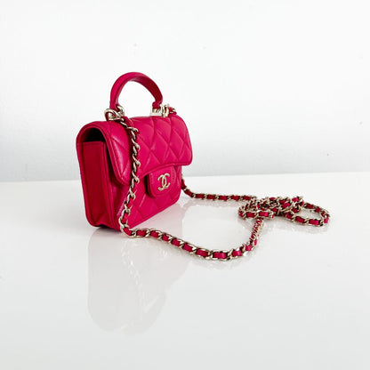 Chanel pink quilted lambskin top handle micro top handle flap bag