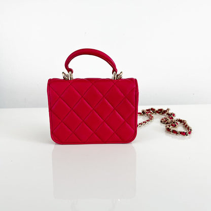 Chanel pink quilted lambskin top handle micro top handle flap bag