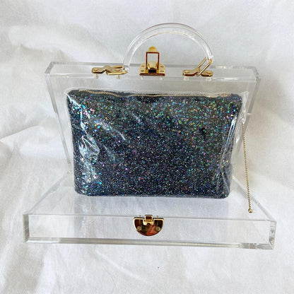 Charlotte Olympia clear acrylic box clutch with blue glittery zip pouch