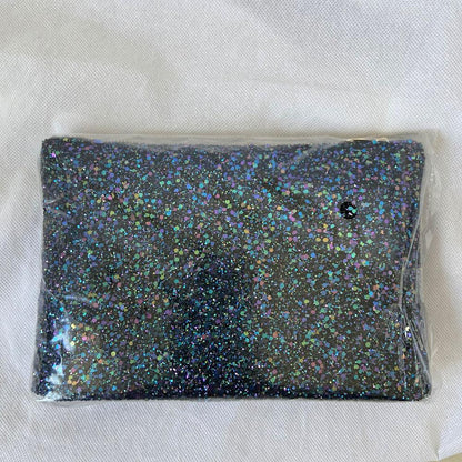 Charlotte Olympia clear acrylic box clutch with blue glittery zip pouch