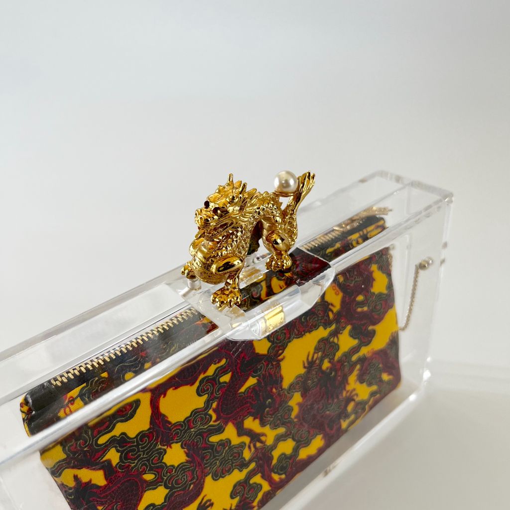 Charlotte Olympia clear plexi clutch with dragon lock