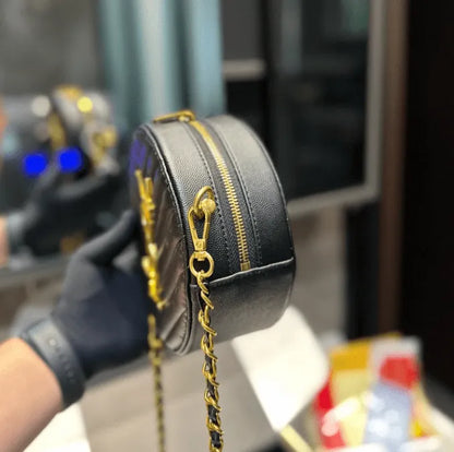 SAINT LAURENT VINYLE ROUND QUILTED GRAIN LEATHER ROUND BAG