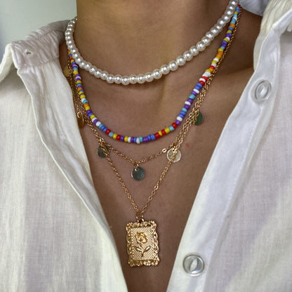 Multiple sets of pearl metal necklaces