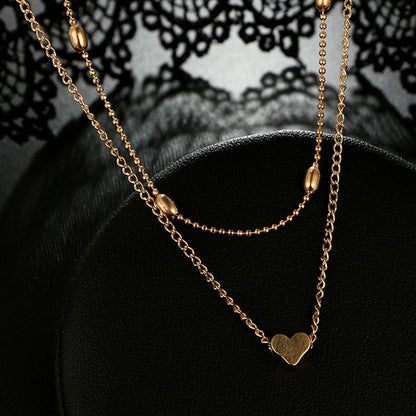 Lovingly simple two-tier brass collar necklace
