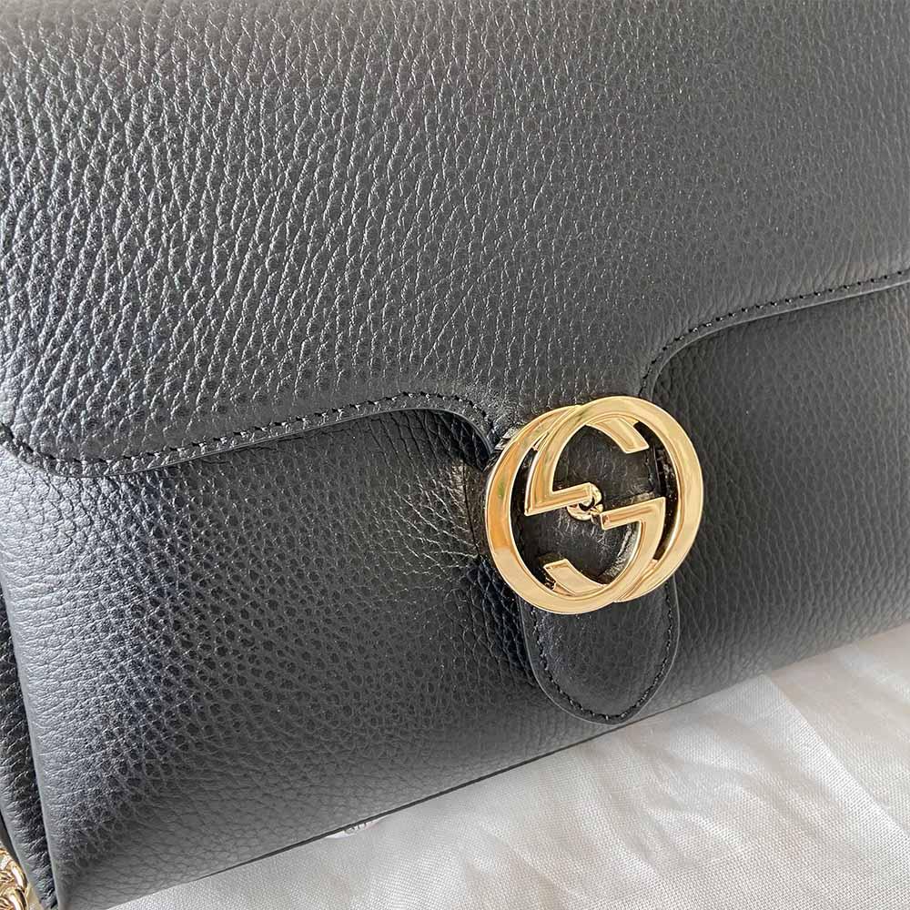 Gucci interlocking G black leather flap bag with goldtone hardware